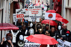 In this file photo taken on March 30, 2023 Sex workers and sympathisers take part in a demonstration to protest plans to shutter the city's historic red light district, to be moved to a new erotic centre, in Amsterdam on March 30, 2023. Sex workers and residents oppose an “erotic centre“ project as Amsterdam wants to move legal prostitution outside the city centre's famed red light district over complaints from residents over crime and visitors' behaviour.
