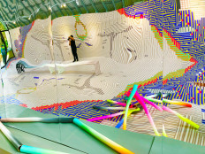 Speaking in tubes: Original concrete flooring is covered in seamless laminated vinyl stickers extending onto its western wall, embellished in a faux-tubular visual “pattern” that seemingly lays out the collaboration’s DNA (JP/Anindito Ariwandono)