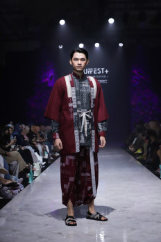 Character: Celebrating Indonesia's identity by wearing a sarong (Courtesy of IFC)