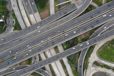 This aerial picture shows motorists commuting on usually busy roads in Jakarta on April 19, as people travel home to celebrate Idul Fitri, which marks the end of the holy month of Ramadan.