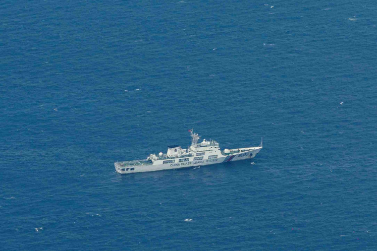 A Chinese Coast Guard vessel is pictured near the Philippine-occupied Thitu Island, in the disputed Spratly Islands, South China Sea, March 9, 2023.