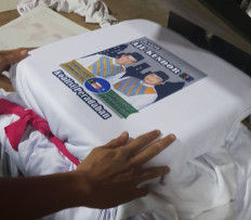 Seasonal surge: Prama Tirta Leksana prints a political T-shirt at his T-shirt printing company in Jakarta. Prama says that his orders at least triple during election season. (Courtesy of Prama Tirta Leksana)