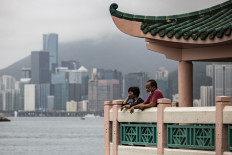 People visit a pavilion at Victoria Harbour in Hong Kong, China, on April 21, 2023.