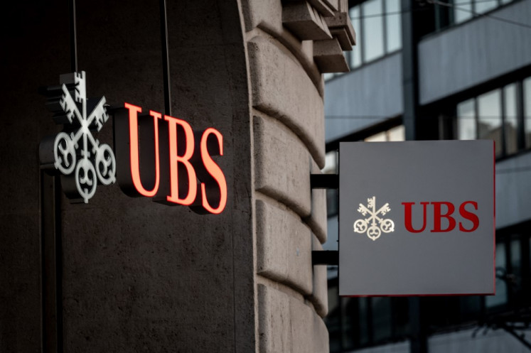 Signs of Swiss bank giant UBS bank are seen in Basel, Switzerland, on April 4, 2023. The investment bank is optimistic that Indonesia's growth outlook remains stable, supported by resilient domestic demand, prudent fiscal and monetary policy, and continued momentum in manufacturing and services.