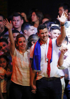 Paraguayan presidential candidate Santiago Pena from the ruling Colorado Party celebrates next to his wife Leticia Ocampos at the party headquarters as he and his running mate Pedro Alliana won Paraguay's presidential race, according to the preliminary official count, in Asuncion, Paraguay April 30, 2023.