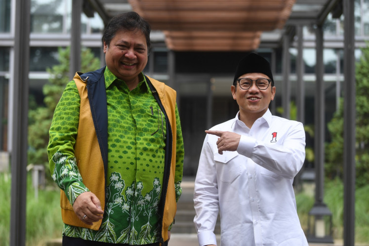 Golkar chairman Airlangga Hartarto (left) and National Awakening Party (PKB) chairman Muhaimin Iskandar pose together after a private meeting on May 3, 2023 in Senayan, South Jakarta. During the meeting, the two reaffirmed their aim to carry on the Joko “Jokowi” Widodo administration’s big-tent coalition beyond 2024 amid complex negotiations over forming electoral alliances.