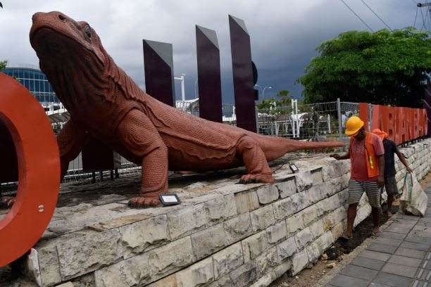 Enter the dragon: Workers clean up a park at Komodo Airport in Labuan Bajo, East Nusa Tenggara, on May 4, 2023, ahead of the ASEAN Summit. The tourist destination, home to the Komodo dragon, will host the summit next week.