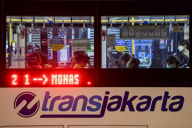 A Transjakarta bus rapid transit (BRT) bus waits for passengers on April 11, 2023 at the Monas (National Monument) bus stop in Central Jakarta.
