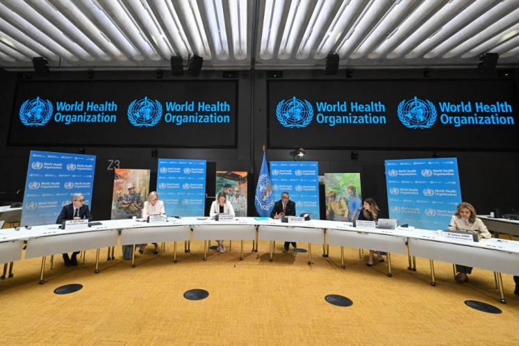 (From left) World Health Organization (WHO) assistant director-general Hanan Balkhy, WHO chief scientist John Reede, WHO assistant director-general Maria Neira, Chef de Cabinet Catharina Boehme, WHO chief Tedros Adhanom Ghebreyesus, WHO technical lead on Covid-19 Maria Van Kerkhove and WHO assistant director-general Samira Asma, attend a press conference on the World Health Organization's 75th anniversary in Geneva, on April 6, 2023. 
