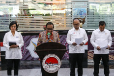 Coordinating Political, Legal and Security Affairs Minister Mahfud MD (second from left) is accompanied by (from left to right) Finance Minister Sri Mulyani Indrawati, Financial Transaction Reports and Analysis Centre (PPATK) head Ivan Yustiavandana and National Police detective chief Comr. Gen. Agus Andrianto address a press conference on April 10 on suspicious transactions involving Finance Ministry officials.
