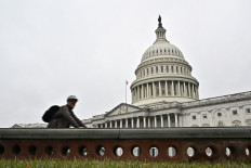 A cyclist passes by the US Capitol building, on the morning of the first day of the 118th Congress in Washington, DC, on Jan. 3, 2023.