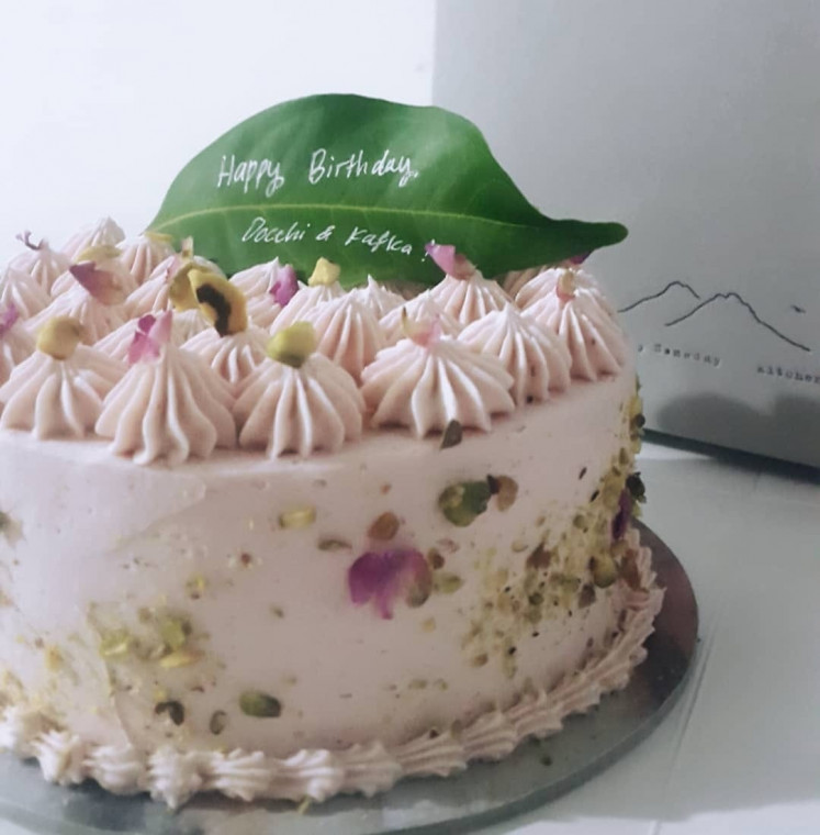 Mad Love from Surely Someday Kitchen is a decadent chocolate cake, hidden under light raspberry swiss meringue buttercream.
