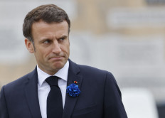 French President Emmanuel Macron looks on as he attends a ceremony held by the statue of Gen. Charles de Gaulle in Paris on May 8, 2023, to mark the 78th anniversary of Victory in Europe Day (VE Day) against the Nazis and the end of the European theater of World War II.
