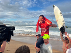 Indonesian surfer Rio Waida is carried by supporters after winning the Sydney Surf Pro in Manly Beach, Australia, May 24, 2022. 