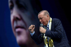 Turkish President Tayyip Erdogan addresses his supporters during a rally ahead of the May 14 presidential and parliamentary elections, in Ankara, Turkey April 30, 2023. 