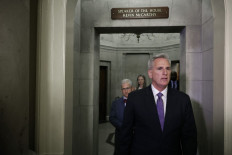 US House Speaker Kevin McCarthy (front) and Rep. Patrick McHenry leave the Speaker's office to talk to reporters at the Capitol following a meeting with President Joe Biden on May 22, 2023 in Washington, DC.