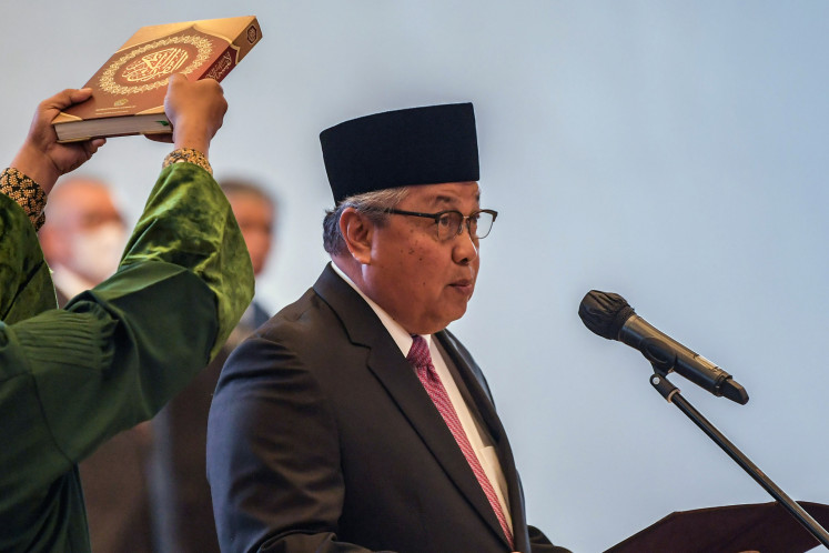 Bank Indonesia (BI) Governor Perry Warjiyo is sworn in for a second five-
year term at the Supreme Court in Central Jakarta, on May 24, 2023.