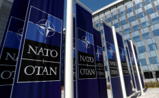 Banners displaying the NATO logo are placed at the entrance of new NATO headquarters during the move to the new building, in Brussels, Belgium April 19, 2018.  Photo