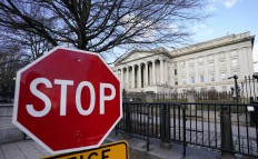 A view shows a stop sign at a security gate to the US Treasury building in Washington, DC, on Jan. 20, 2023. 
