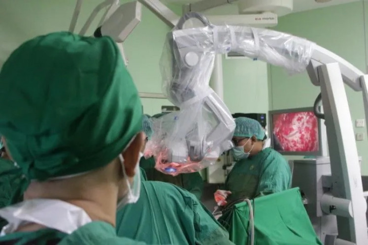 Doctors from Jember Pulmonary Hospital and Surabaya’s Dr. Soetomo General Regional Hospital perform their first joint neurosurgery on a patient with a brain aneurysm on May 27, 2023, at the lung hospital in Jember, East Java.