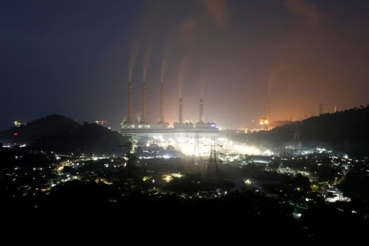 Coal power: Smoke and steam billow from a coal-fired power plant owned by Indonesia Power in Suralaya, Banten province, on July 10, 2020. Indonesia is committed to energy transition toward net zero in 2060.