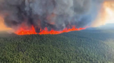 This June 8, 2023, handout still image from a video by British Columbia Wildfire Service, shows an aerial view of the West Kiskatinaw River wildfire located 10 kilometers (6 miles) east of Tumbler Ridge, Canada. 