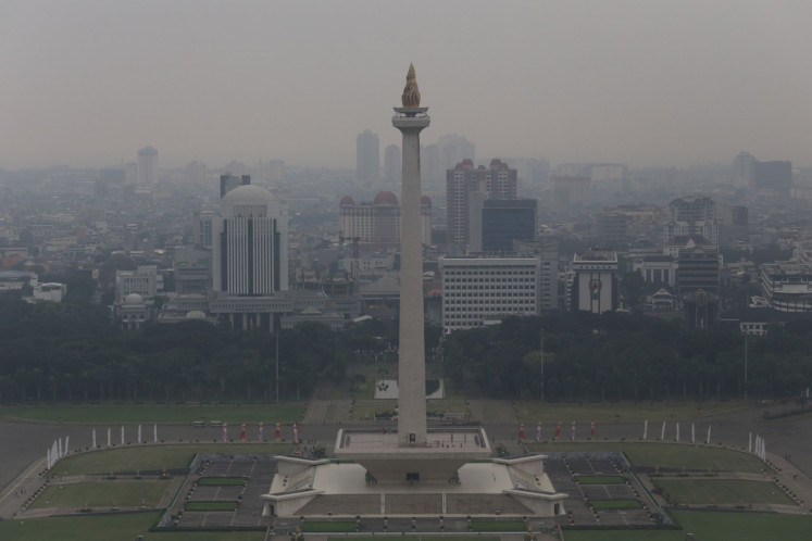 Jakarta’s landmark National Monument complex is seen in this photo taken on June 6, 2023, with the polluted sky in the background. The increase of cars on the road is one key factor for this deteriorating air quality. 