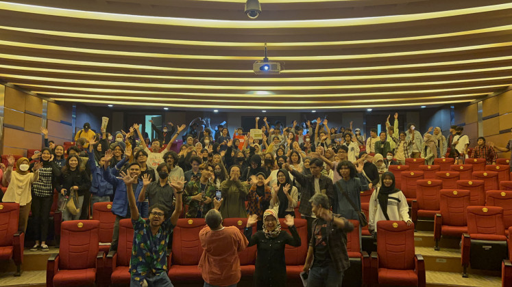 The audience poses enthusiastically with the speakers of the event themed Photojournalism in the Spirit of Participation, at Padjajaran University in Jatinagor, on Tuesday 