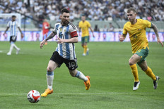 Argentina's Lionel Messi (2nd left) fights for the ball during a friendly football match against Australia at the Workers' Stadium in Beijing on June 15, 2023. 
