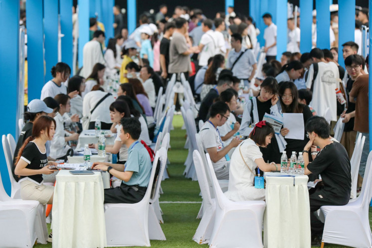 This photo taken on June 14, 2023, shows university graduates and youths attending a job fair in Yibin, in China's southwestern Sichuan province. 