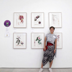 Botanical artist Eunike Nugroho is pictured with her award-winning exhibition at the Royal Horticultural Society (RHS) Botanical Art & Photography Show in London on June 16, 2023. 
