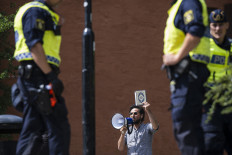 Salwan Momika protests outside a mosque in Stockholm on June 28, during Idul Adha (Day of Sacrifice).