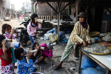 Children begin to capture moments in their hometown with a tool as simple as a cardboard camera.