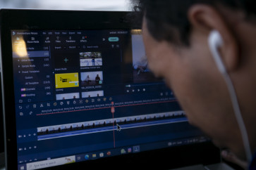 RBS Production Coordinator Sugihermanto checks the sound and image results from the reportage.