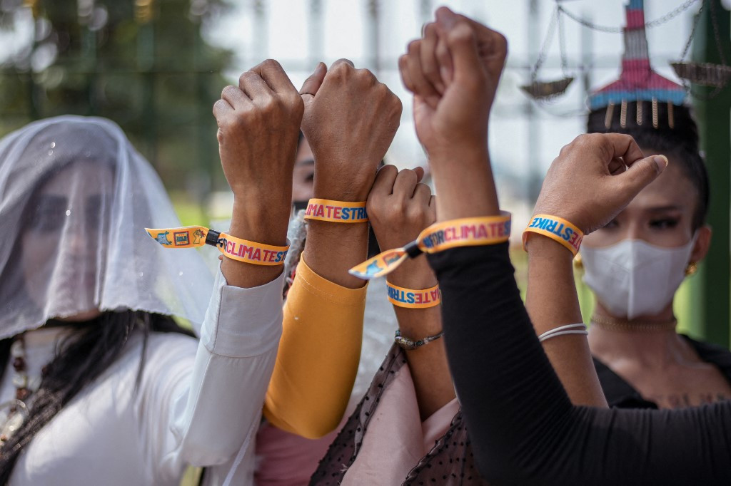 Environmental activists march along a road on Sept. 23, 2022, during a global day of action on climate change in Jakarta. 
