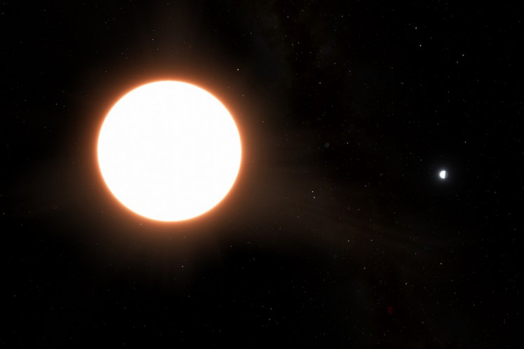 This handout image released on July 10, 2023, by the European Space Agency (ESA) shows an artist impression of exoplanet LTT9779b orbiting its host star. 
