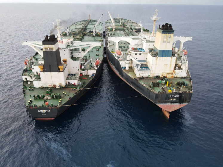The Iranian-flagged MT Arman 114 and the Cameroon-flagged MT S Tinos sail side by side in the North Natuna Sea on July 7, 2023, while conducting an illegal ship-to-ship transfer of crude oil, according to the Maritime Security Agency (Bakamla).