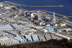 An aerial view shows the storage tanks for treated water at the tsunami-crippled Fukushima Daiichi nuclear power plant in Okuma town, Fukushima prefecture, Japan on Feb. 13, 2021.