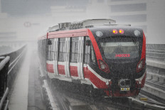A Greater Jakarta LRT train passes during a trial run on July 12, 2023.