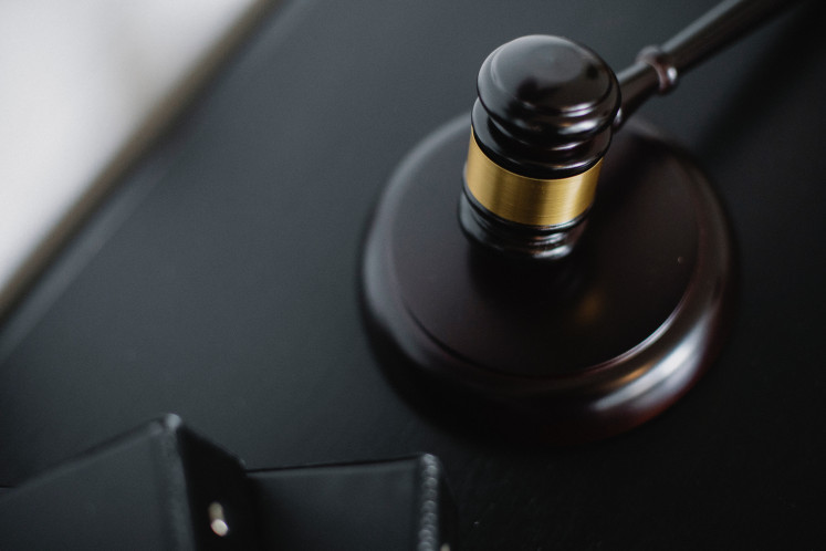 This undated illustration picture shows a gavel in a courtroom.