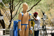 Researchers monitor a heat and wind experiment with ANDI, an Advanced Newton Dynamic Instrument, at Arizona State University (ASU) during a record heat wave in Phoenix, Arizona, on July 20, 2023. ANDI is the first outdoor sweating, breathing, and moving thermal manikin and Arizona researchers have deployed it in the southwestern state's capital Phoenix which is currently enduring its longest heat wave in history: on Friday, the mercury exceeded 110 degrees Fahrenheit (43 degrees Celsius) for the 22nd day in a row.