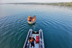 This handout photo from the National Rescue Agency (Basarnas) taken and released on July 24, 2023 shows members of a rescue team setting out to conduct search and rescue operations in Buton Tengah, southeast Sulawesi after a ferry sank. 