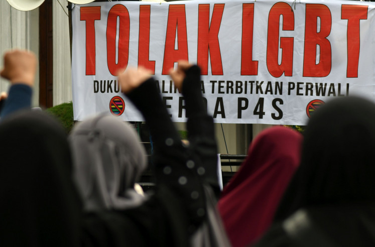 People take part in a rally against the LGBT community in Bogor, West Java, on July 14, 2023. 