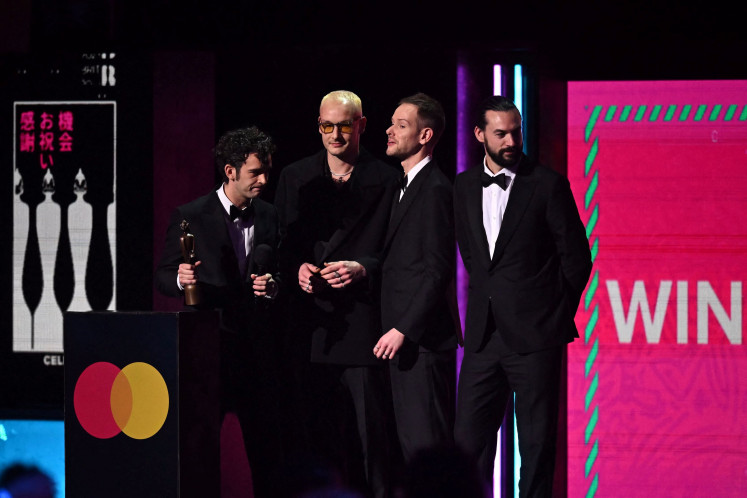 British rock band The 1975 react after receiving the best rock and alternative act of the year award during the BRIT Awards 2023 ceremony and live show in London on Feb. 11, 2023. 