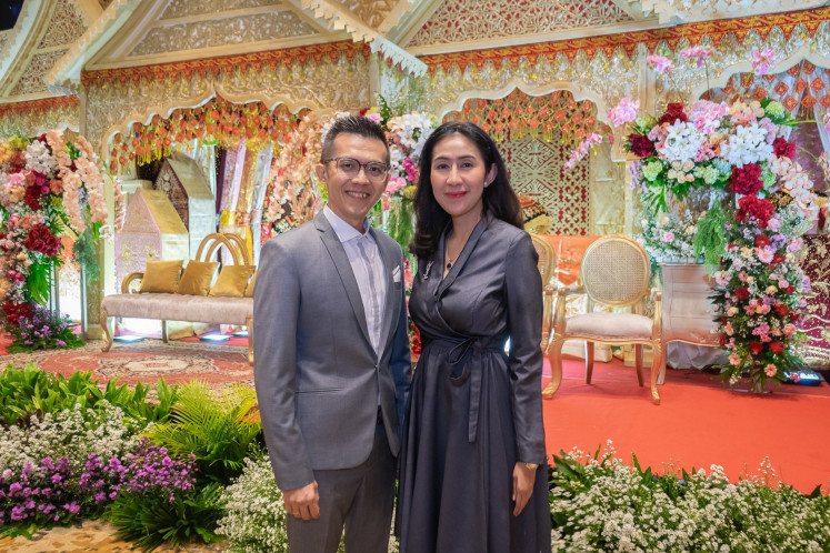 Estare Group director Marcellinus Suryanto (left) poses for a photograph with Menara Danareksa general manager Rika Rachmawati Rasyid.