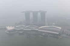 Smoke on the water: Haze blankets the Marina Bay Sands hotel and resort in Singapore on Sept. 18, 2019. Toxic haze from Indonesian forest fires at that time closed thousands of schools across Singapore and in neighboring Malaysia.


