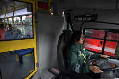 Martha Isabel Gutierrez drives an electric public bus in Bogota on September 30, 2022. The mayor of Bogotá, Claudia Lopez, launched its first public bus system with electric buses driven mostly by women.