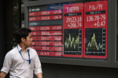 Tokyo shares open lower ahead of US inflation data