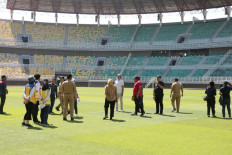 Members of a FIFA delegation gather on July 31, 2023 for a field inspection at Gelora Bung Tomo Stadium in Surabaya, East Java, accompanied by officials from the Soccer Association of Indonesia (PSSI) and the Surabaya city administration.