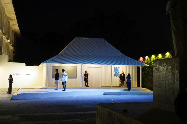 Checking in: Visitors take pictures at the entrance of Artjog 2023, which is itself an art installation by Mella Jaarsma.
